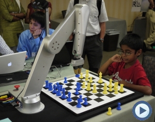 image of chess playing robot