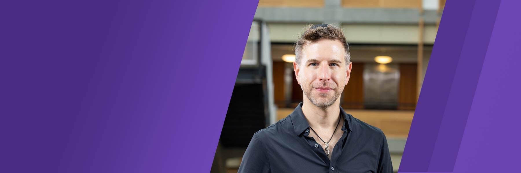 Examining myths about AI, computer science degrees and employment Magnifying glass resting on a laptop keyboard reflecting the light of the keys and screen