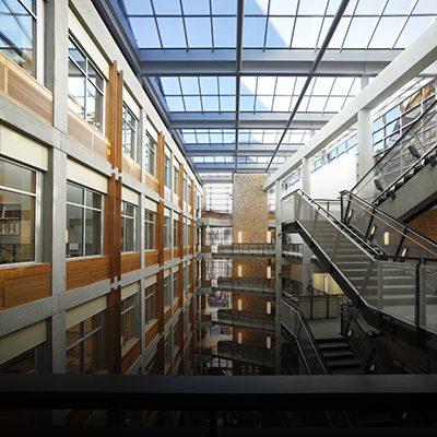 Allen Center atrium with floating stairwell, interior office windows and a vast skylight