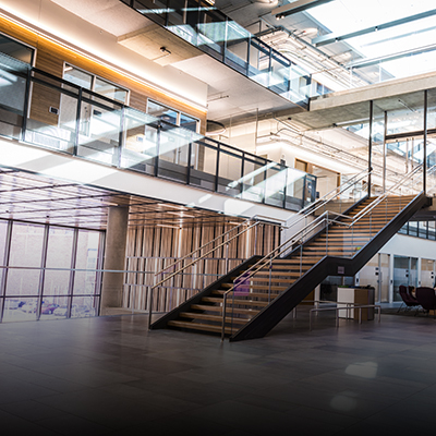 Gates Center atrium with floating stairwell bathed in light from skylight