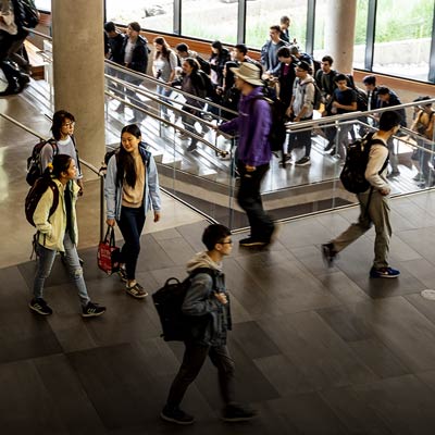 Students walking to classes in the Gaates Center.