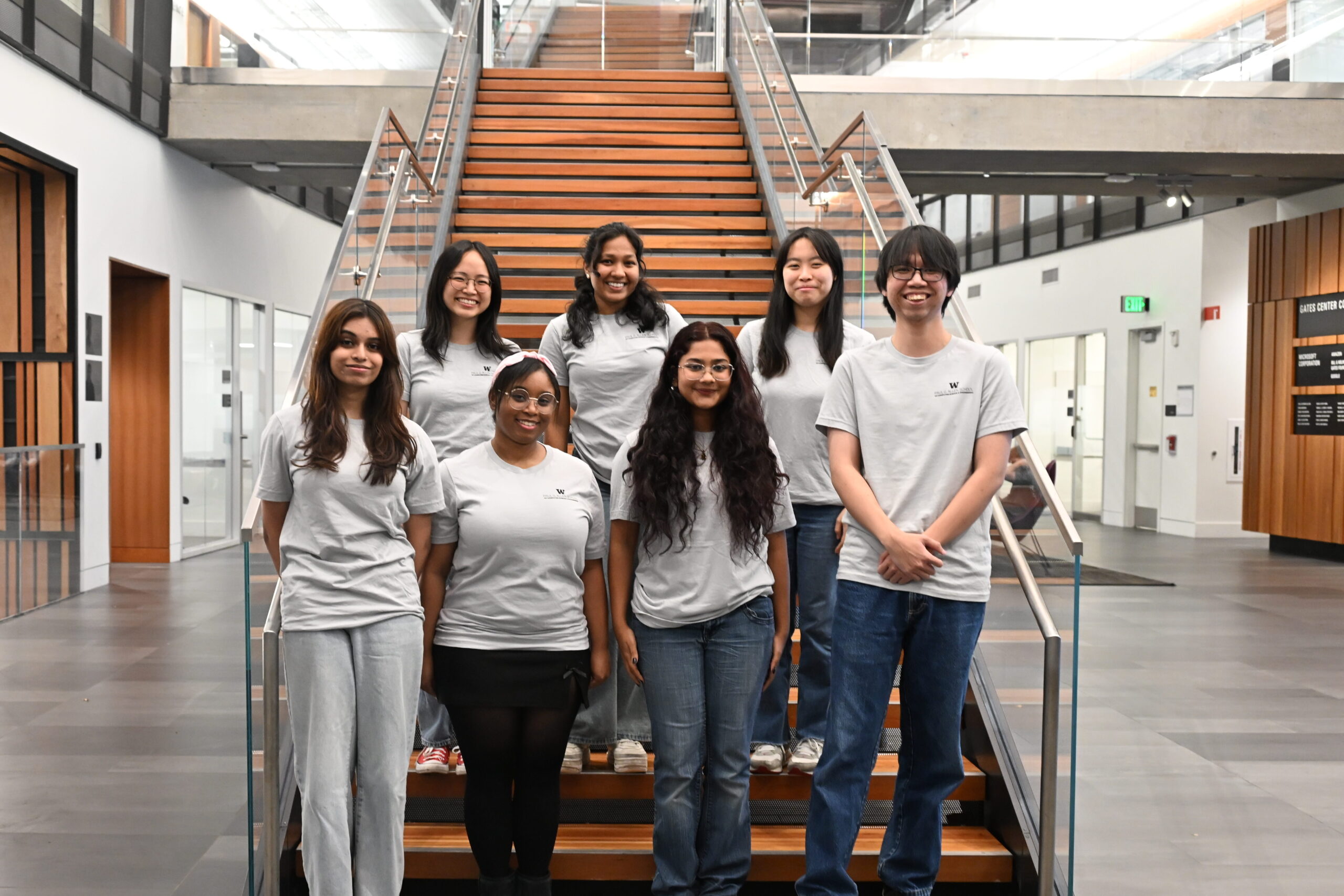 The Allen School Student Recruitment Representative team standing on the innovation staircase in the Gates Center (CSE2)
