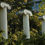 Three columns among the trees in the Sylvan Grove.