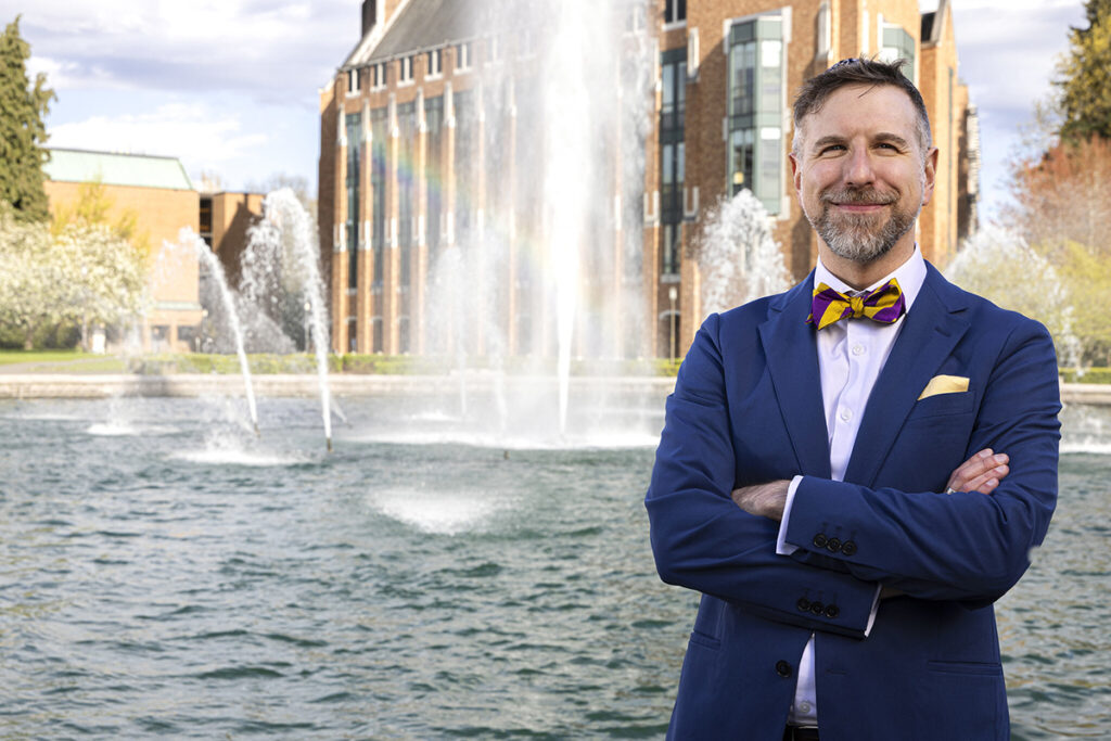 Noah A. Smith poses in front of the Drumheller Fountain at the University of Washington.