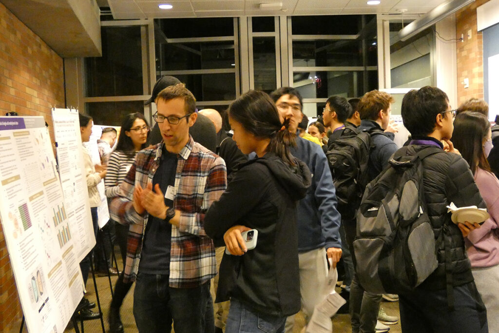 students presenting at a poster session