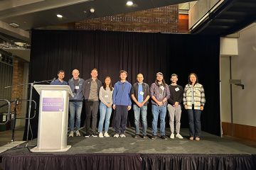The Madrona Prize winner and runner-ups pose on stage with the award presenters.