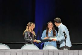 At NeurIPS 2025, Yejin Choi and Liwei Jiang accept the Best Paper Award from the oral session chair.
