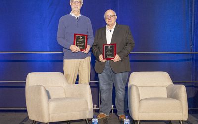 Allen School professor emeritus Richard Ladner holds the SIGCSE Award for Outstanding Contribution to Computer Science Education next to Paul Tymann, faculty at the Rochester Institute of Technology, who received the SIGCSE Award for Distinguished Service to the Computer Science Education Community.