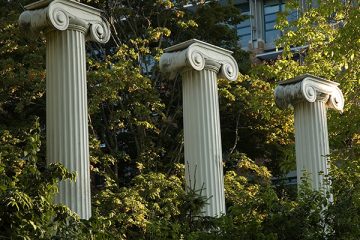 Three columns among the trees in the Sylvan Grove.