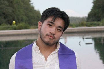 Portrait of Andre Ye in front of a fountain