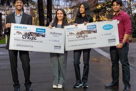 Two pairs of students hold mock award checks made out to CPRight from the Holloman Health Innovation Challenge. One check is is sponsored by the Hollomon Family for $15,000 and the other is sponsored by NaturaCur Wound Healing for $2,500