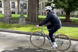 A person riding a bicycle on a roadway