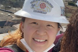Esther Jang wearing a hard hat outdoors
