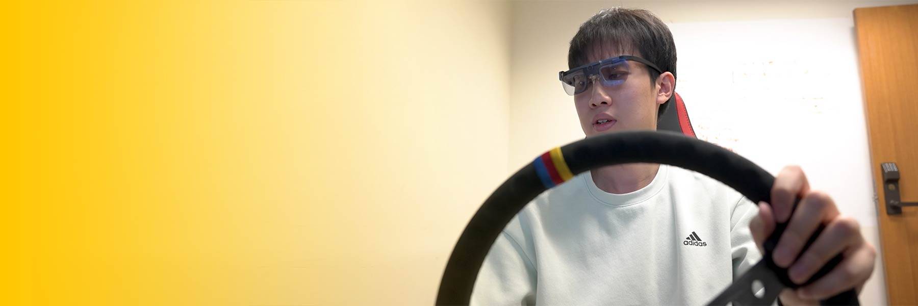 Magnifying glass resting on a laptop keyboard reflecting the light of the keys and screen